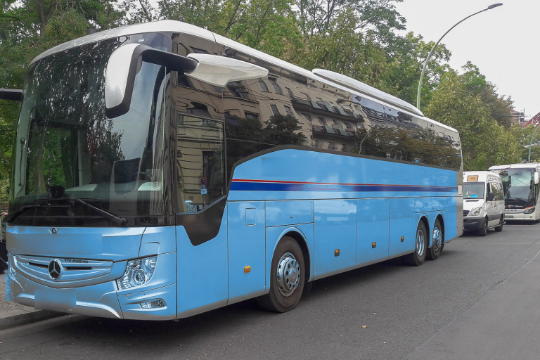 Light blue Mercedes-Benz Tourismo coach for large group airport transfers in Athens